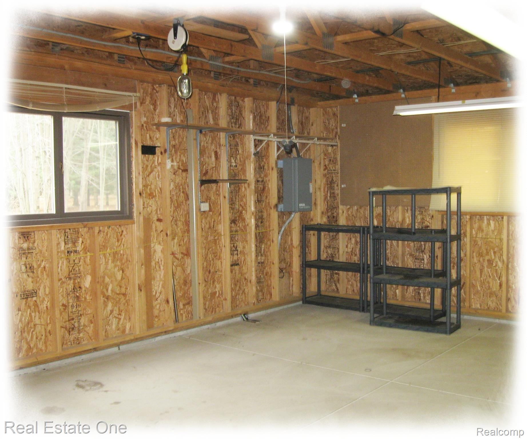 40425 Willis Road Belleville, MI 48111 - Photo 25 of 36 Great work room or second garage. Enough space for two cars.