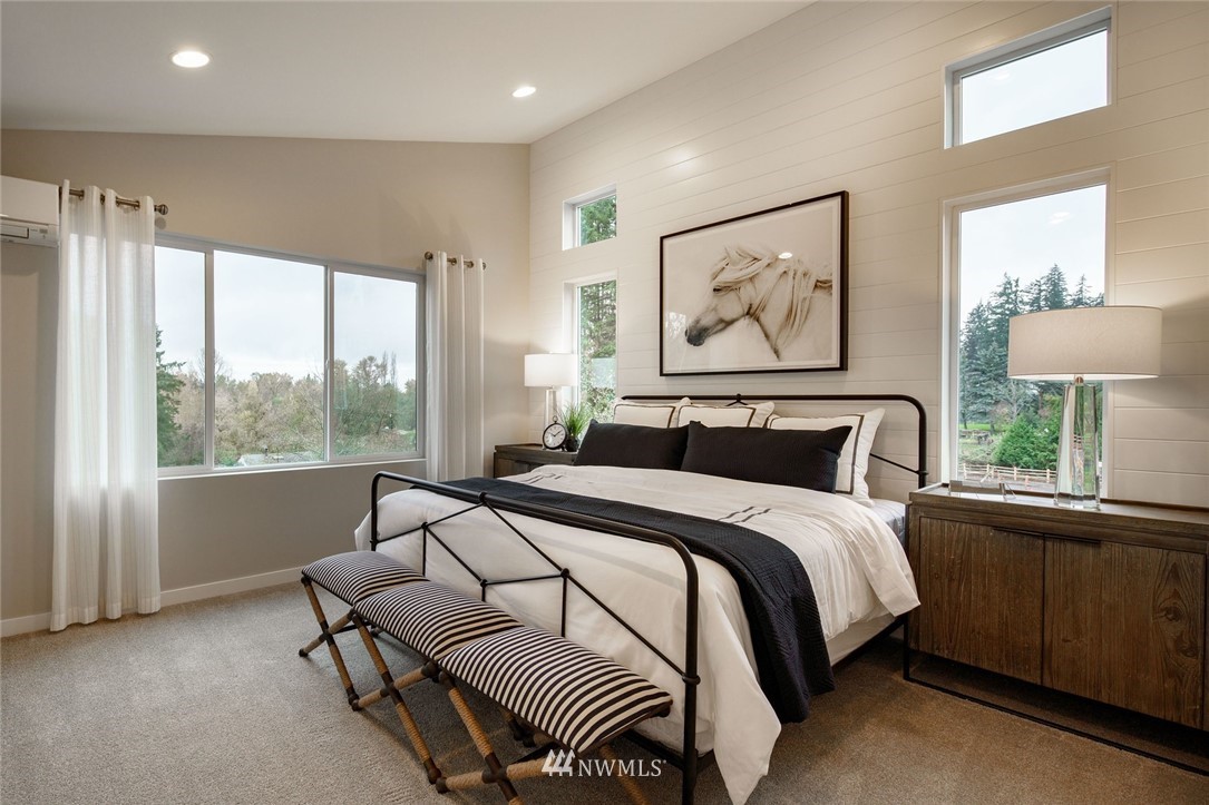 619 238th Street Southeast, Unit A Bothell, WA 98021 - Photo 13 of 21 a bedroom with bed and a large window