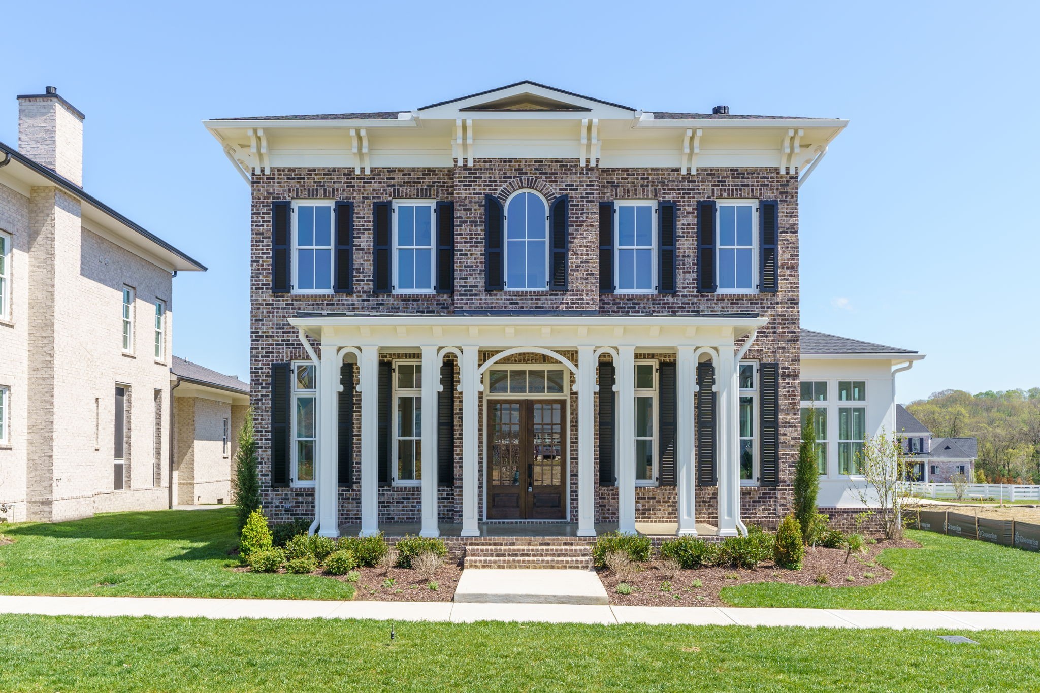 6076 Pasquo Road Nashville, TN 37221 - Photo 1 of 69 a front view of a house with a yard