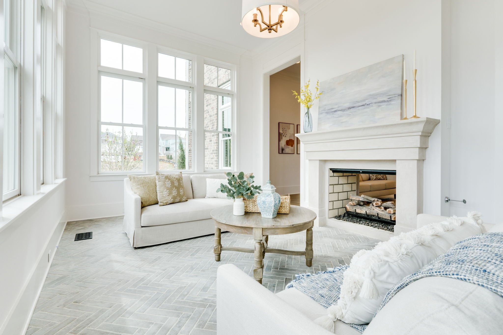 6076 Pasquo Road Nashville, TN 37221 - Photo 16 of 69 a living room with furniture a fireplace and a large window
