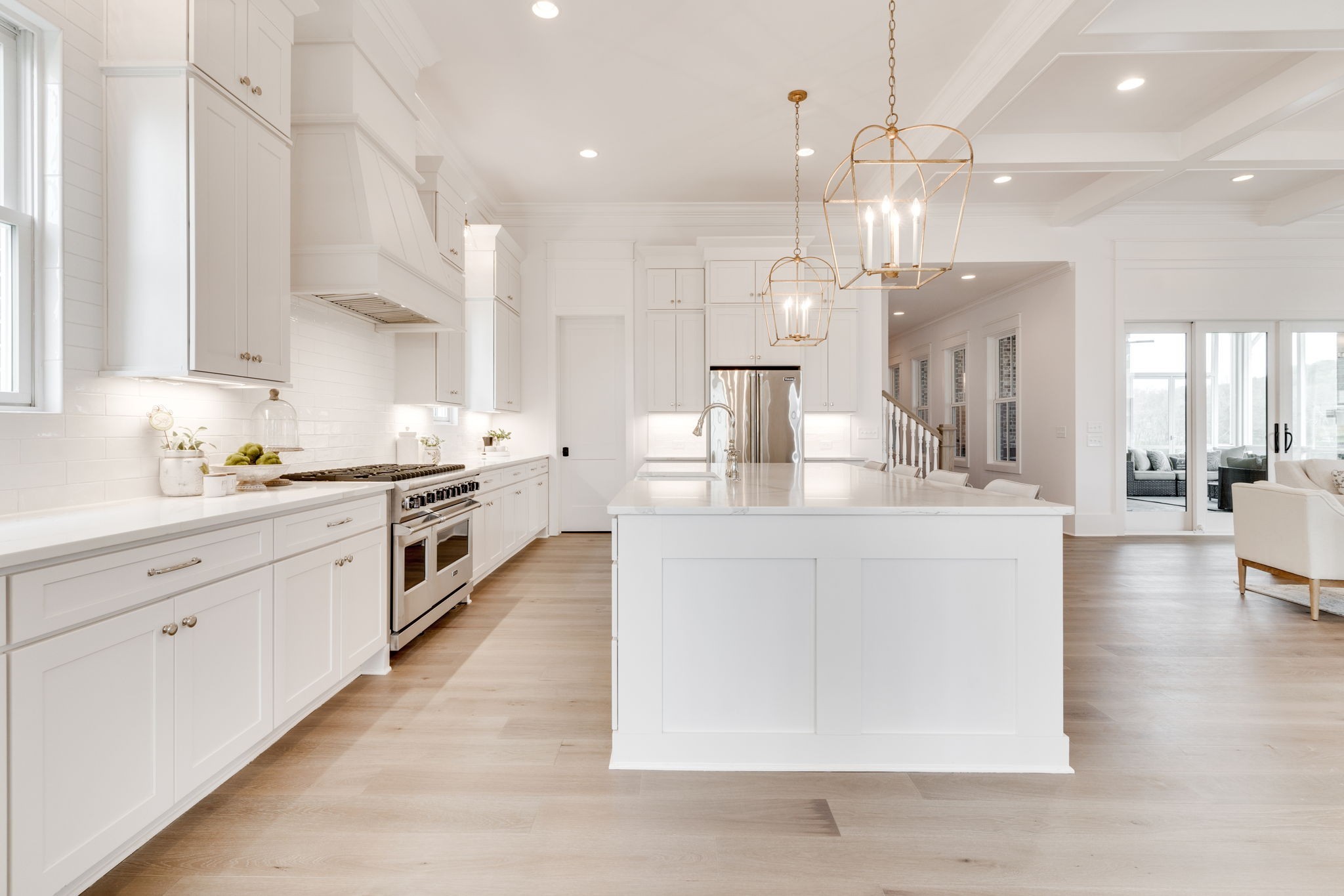 6076 Pasquo Road Nashville, TN 37221 - Photo 21 of 69 a large white kitchen with lots of counter space wooden floor and appliances