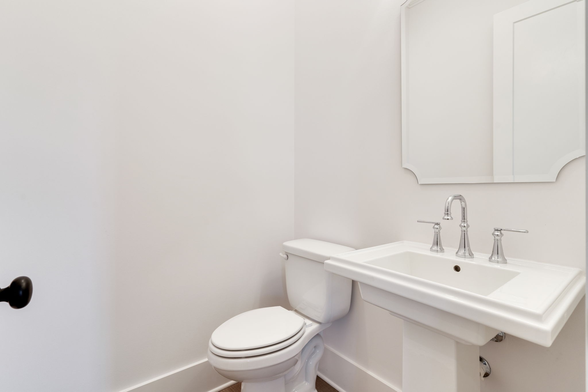 6076 Pasquo Road Nashville, TN 37221 - Photo 30 of 69 a white toilet sitting next to a white sink