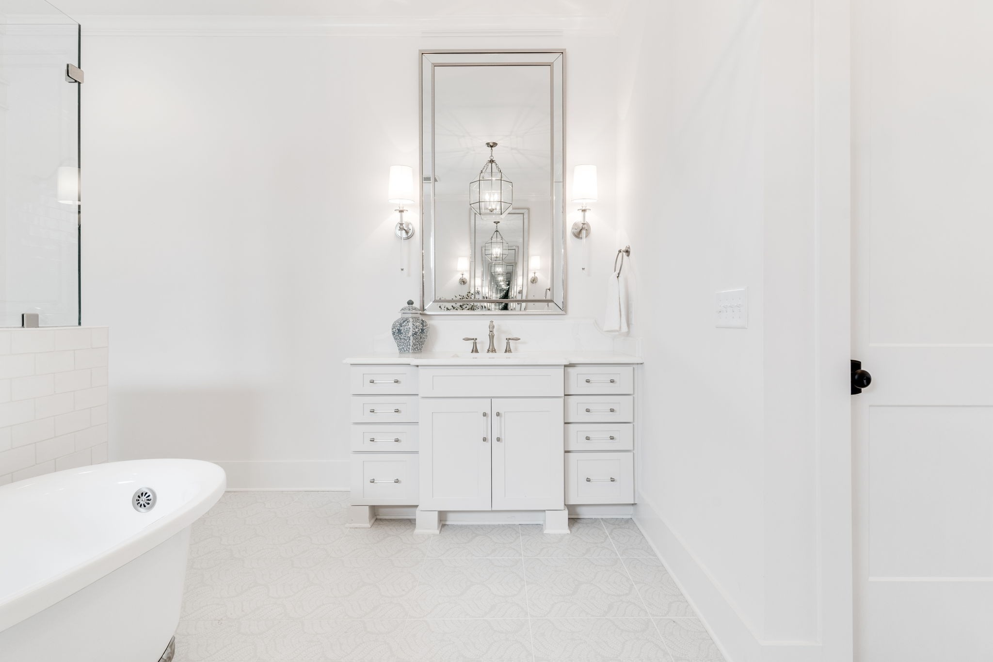 6076 Pasquo Road Nashville, TN 37221 - Photo 37 of 69 a bathroom with a sink a vanity and a mirror