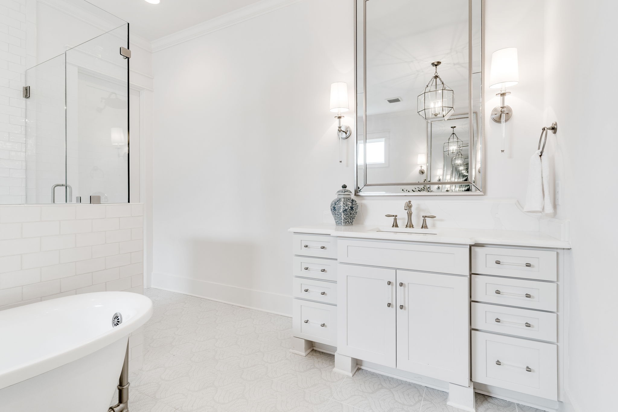 6076 Pasquo Road Nashville, TN 37221 - Photo 38 of 69 a bathroom with a bathtub sink vanity and mirror