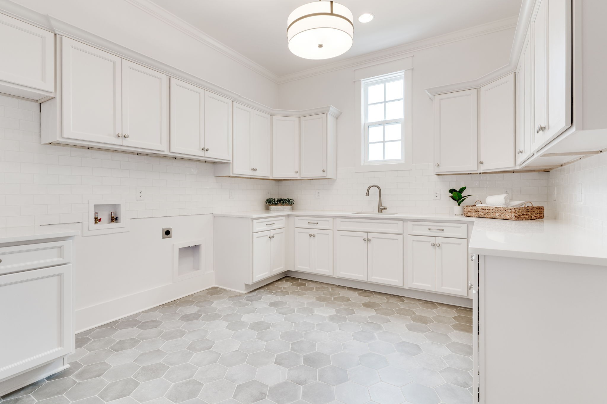 6076 Pasquo Road Nashville, TN 37221 - Photo 45 of 69 a kitchen with white cabinets and window