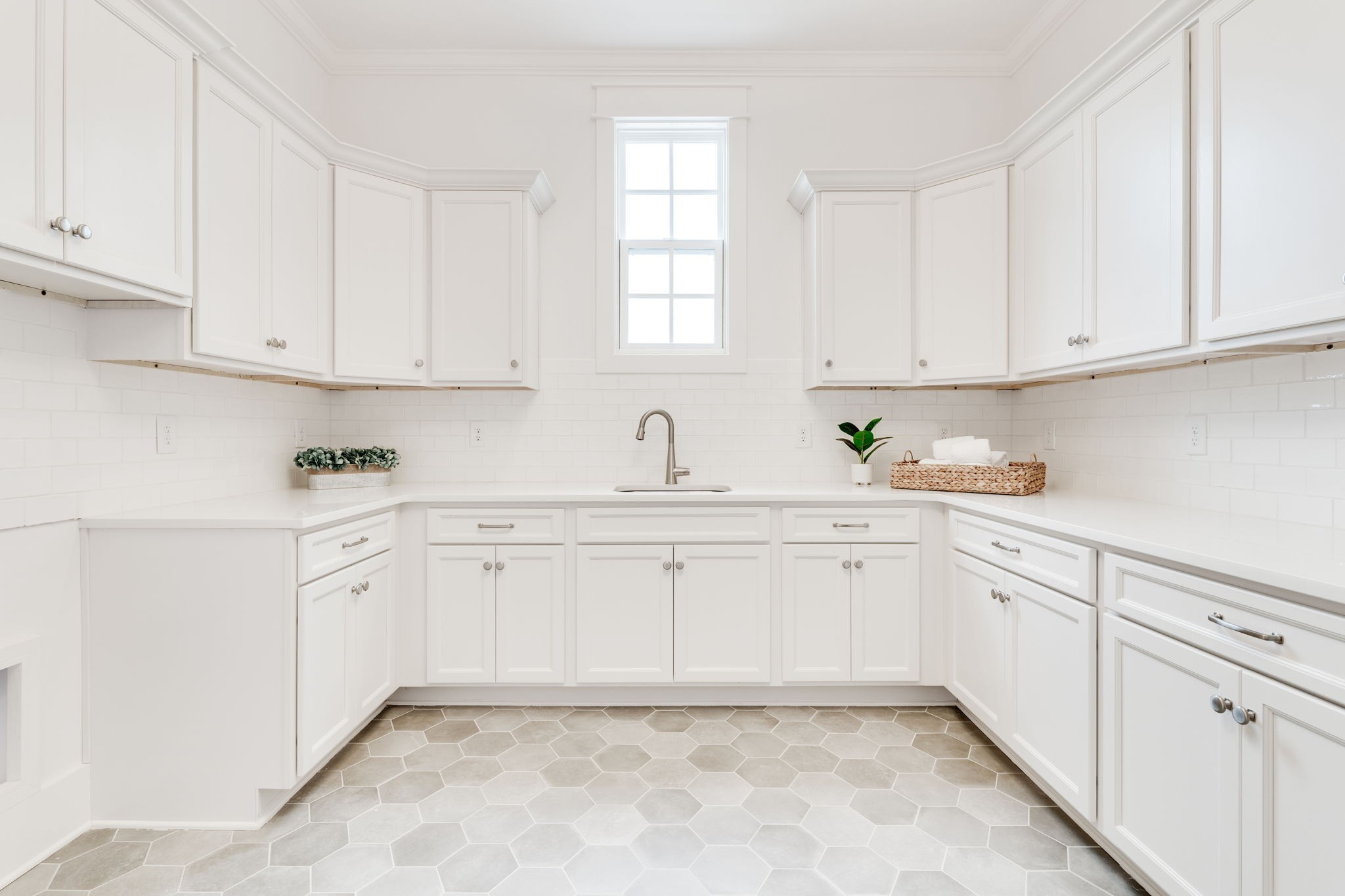 6076 Pasquo Road Nashville, TN 37221 - Photo 46 of 69 a kitchen with granite countertop white cabinets white stainless steel appliances with sink and dishwasher