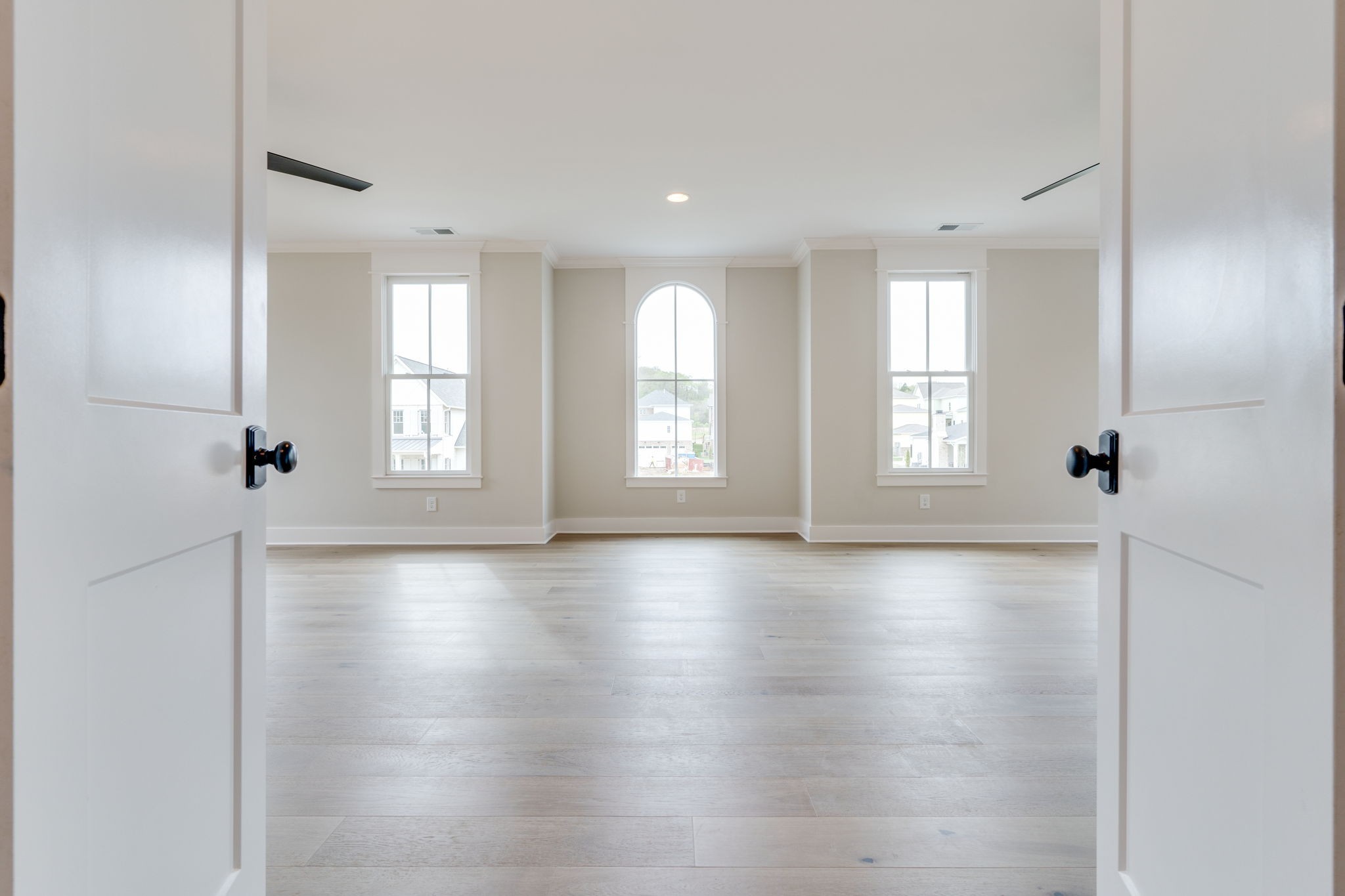 6076 Pasquo Road Nashville, TN 37221 - Photo 48 of 69 a view of an empty room with wooden floor and window