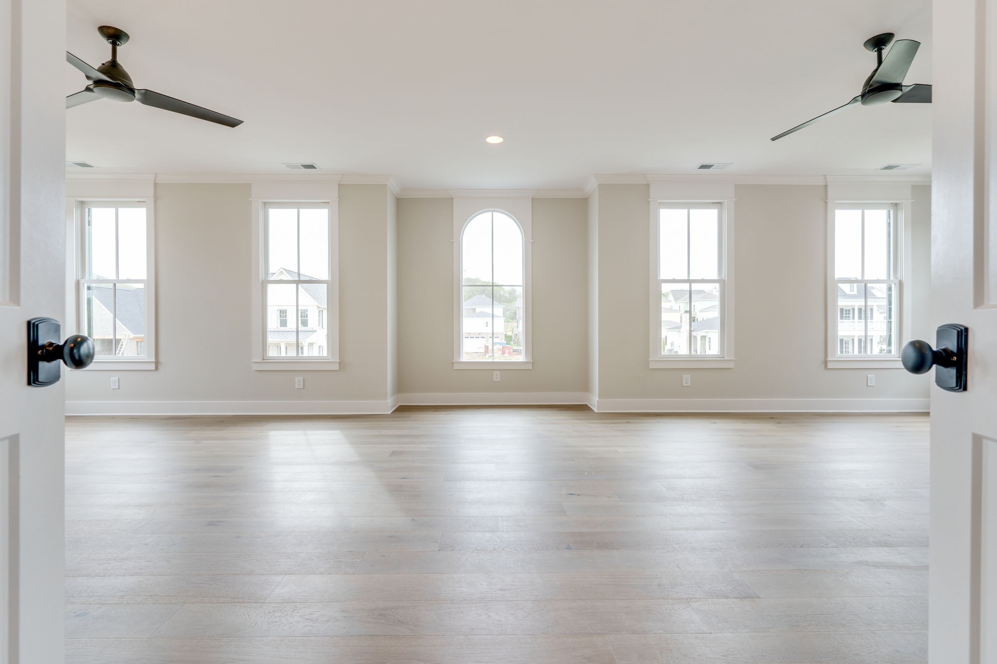 6076 Pasquo Road Nashville, TN 37221 - Photo 49 of 69 an empty room with wooden floor and windows