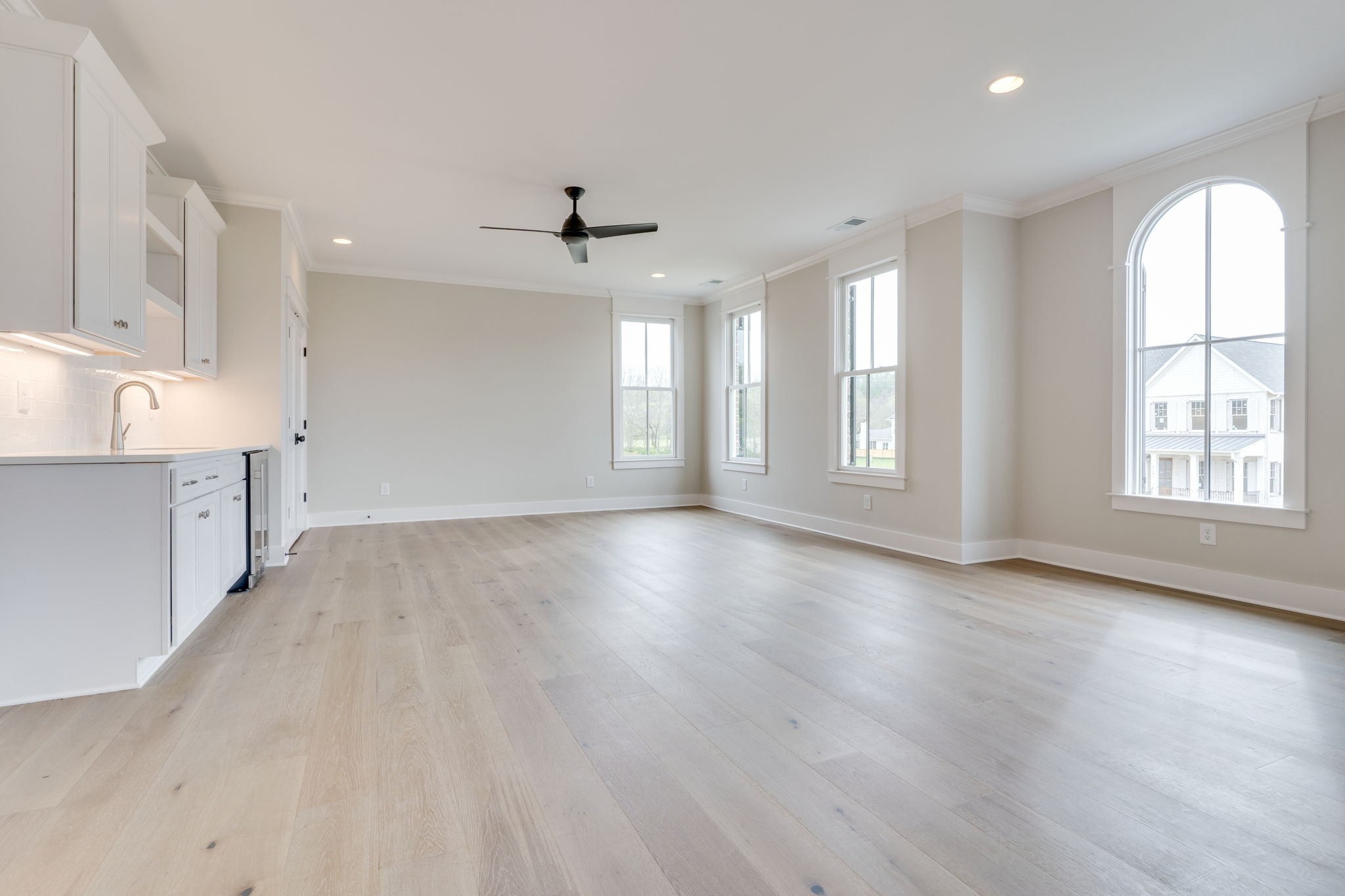 6076 Pasquo Road Nashville, TN 37221 - Photo 52 of 69 a view of an empty room with a window and wooden floor
