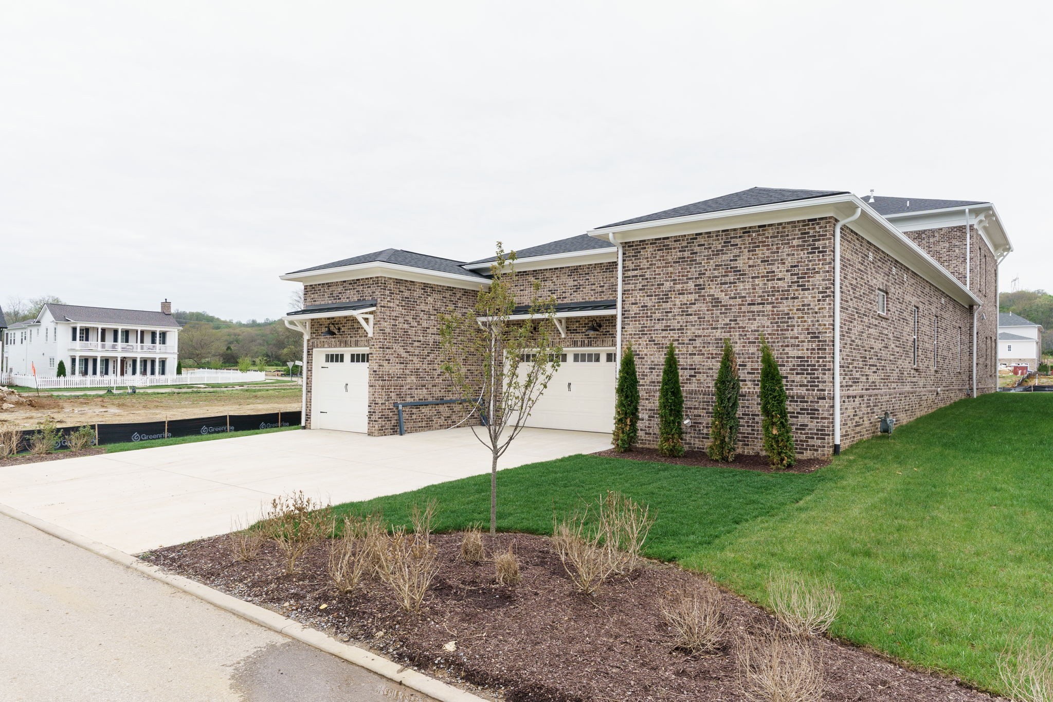 6076 Pasquo Road Nashville, TN 37221 - Photo 63 of 69 a view of a grey house with a yard