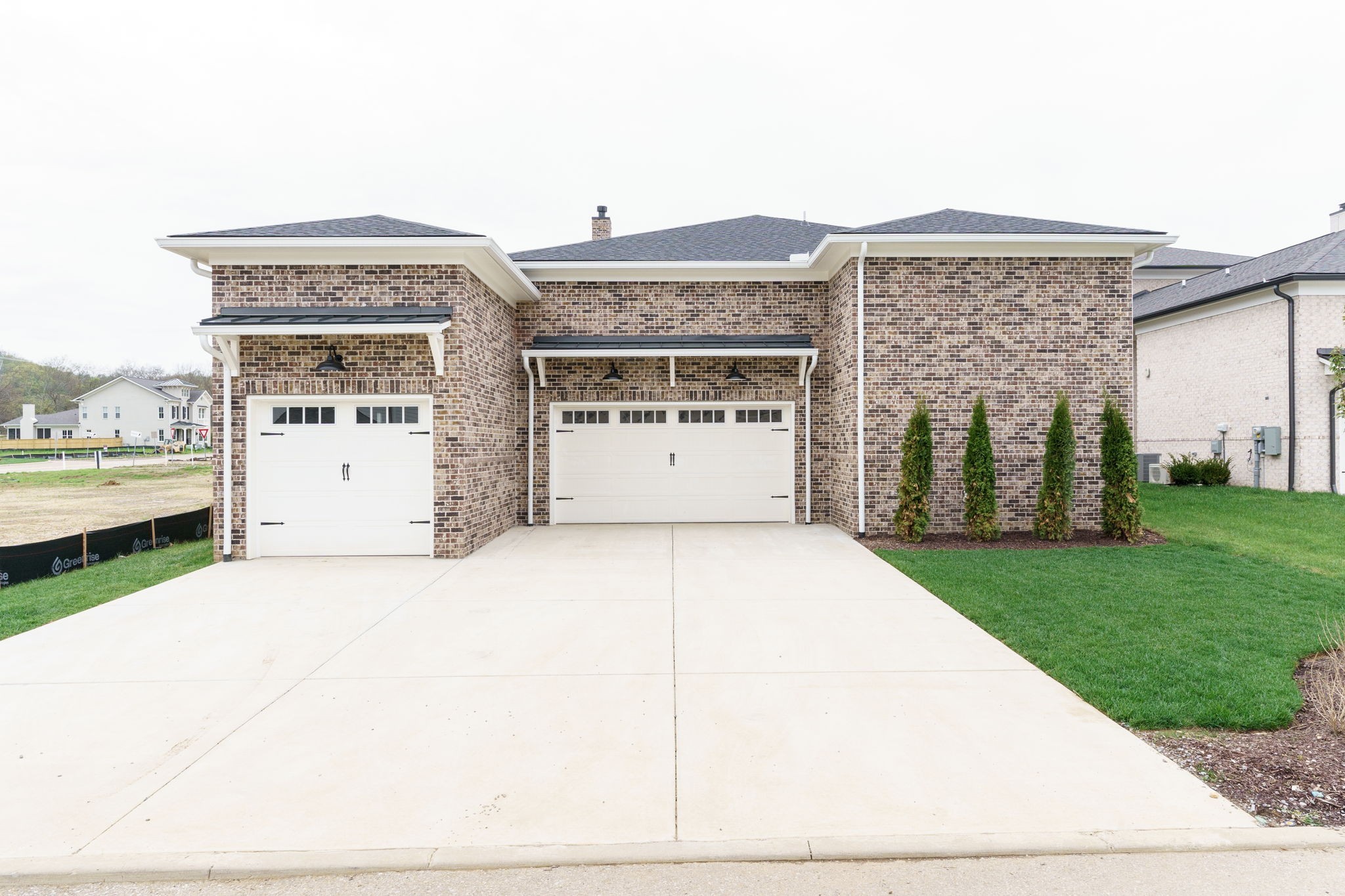 6076 Pasquo Road Nashville, TN 37221 - Photo 64 of 69 a front view of a house with a yard and garage