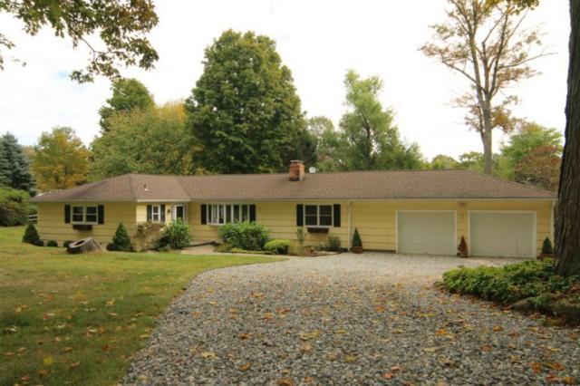104 Bayberry Hill Road Ridgefield, CT 06877 - Photo 1 of 1 a front view of a house with a yard