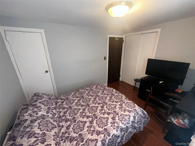 a bathroom with a toilet a sink and view kitchen