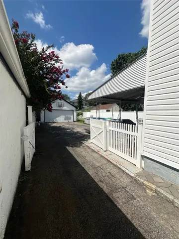 a view of a porch with a bench