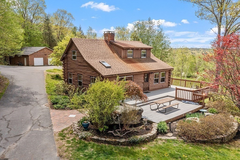 115 Gray Road Templeton, MA 01468 - Photo 1 of 40 a aerial view of a house with table and chairs with wooden fence