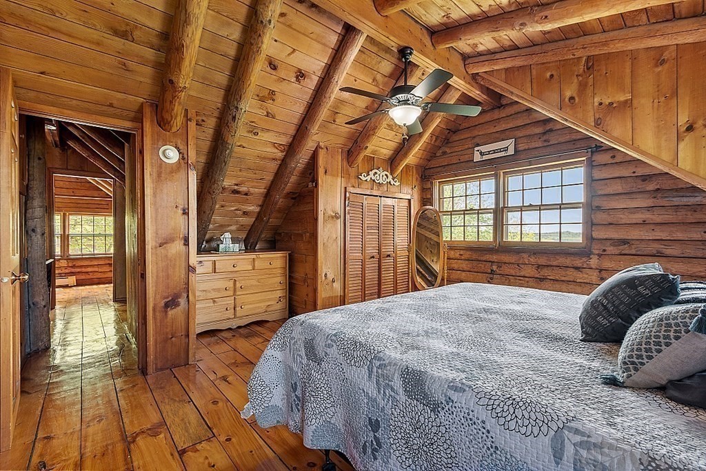 115 Gray Road Templeton, MA 01468 - Photo 22 of 40 a bedroom with a bed and wooden floor