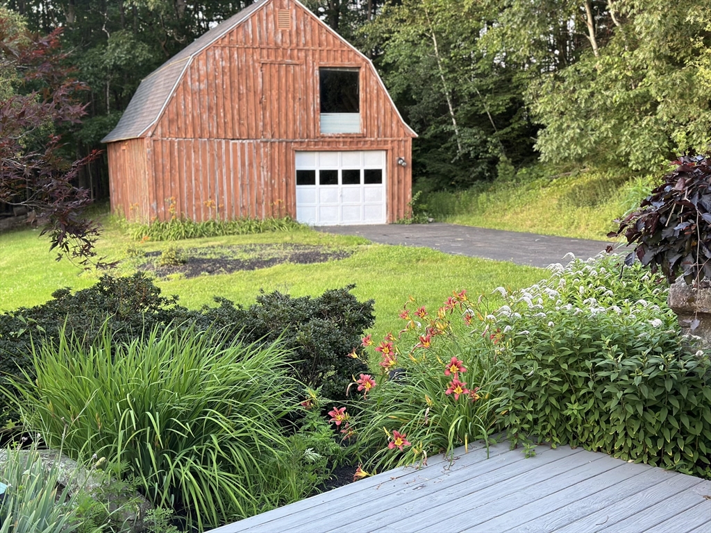 115 Gray Road Templeton, MA 01468 - Photo 25 of 40 a view of a house with a yard and garden