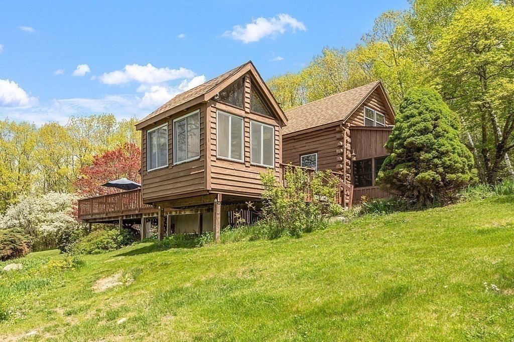 115 Gray Road Templeton, MA 01468 - Photo 6 of 40 a front view of a house with a garden