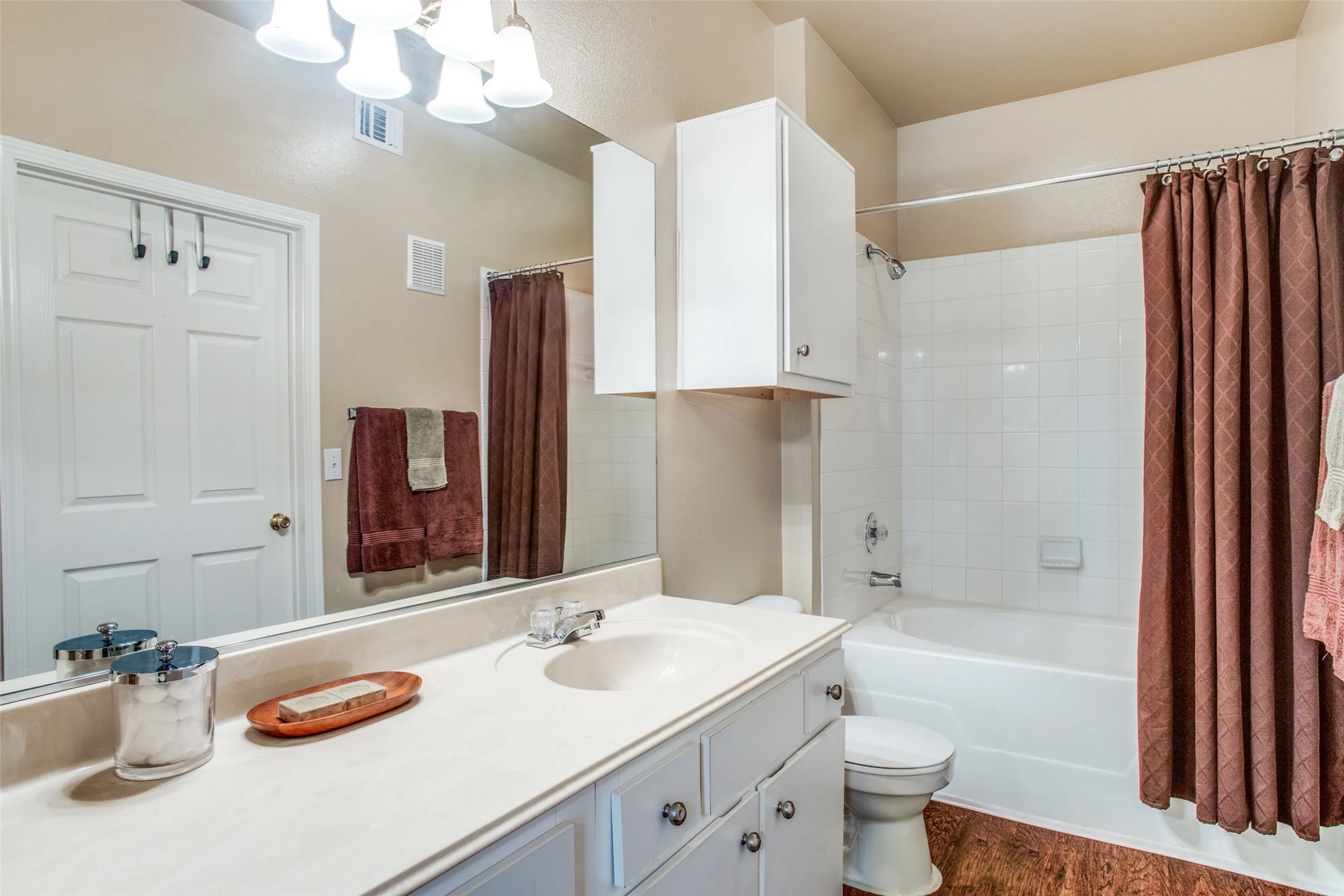 10221 Centrepark Drive, Unit A328 Houston, TX 77043 - Photo 9 of 16 a bathroom with a granite countertop sink toilet and shower