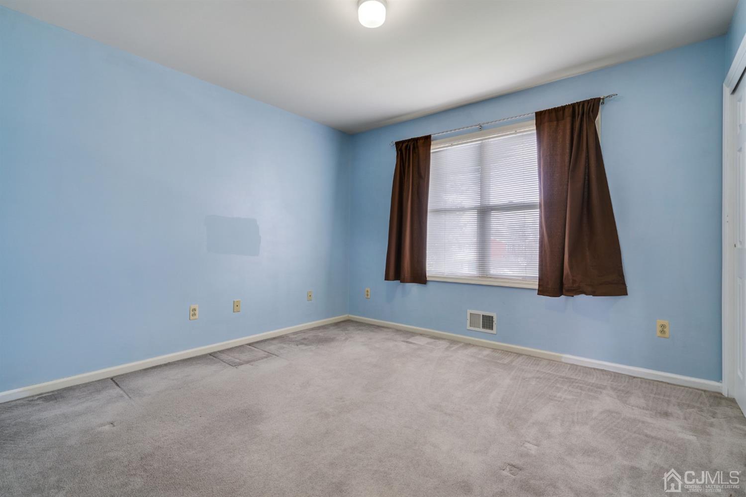 9 Poplar Road Piscataway, NJ 08854 - Photo 14 of 35 a view of an empty room with a window