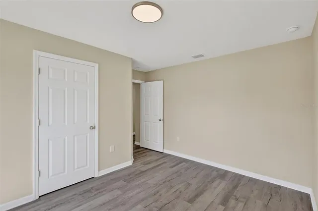 a view of a livingroom with wooden floor