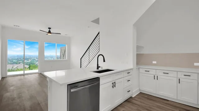 a kitchen with a sink and a window