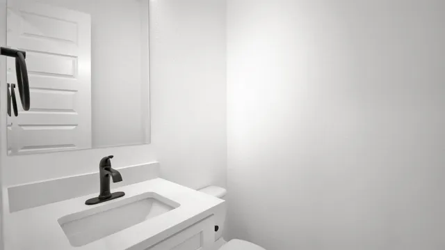 a bathroom with a sink and mirror