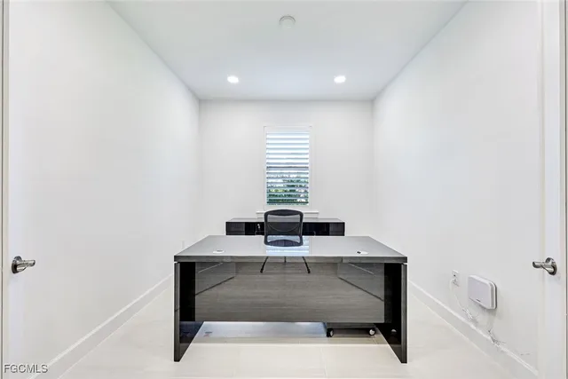 a workspace with furniture and window