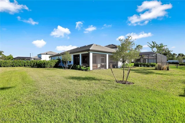 a view of a house with a yard porch and sitting area