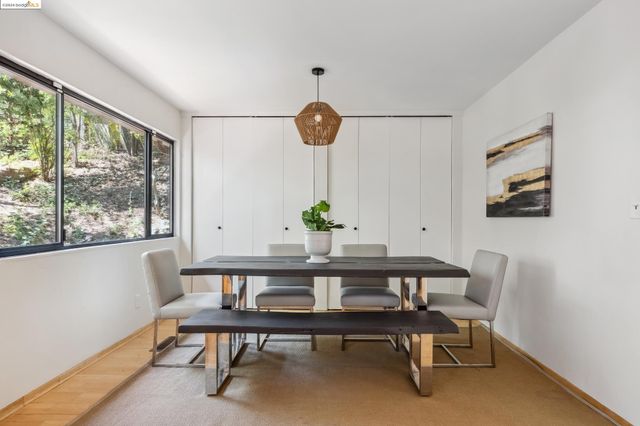 a view of a dining room with furniture and a livingroom