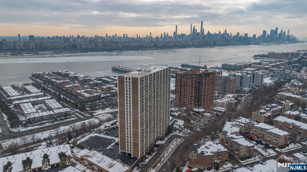 250 Gorge Road, Unit 8J Cliffside Park, NJ 07010 - Photo 4 of 36 a view of a lake from a city