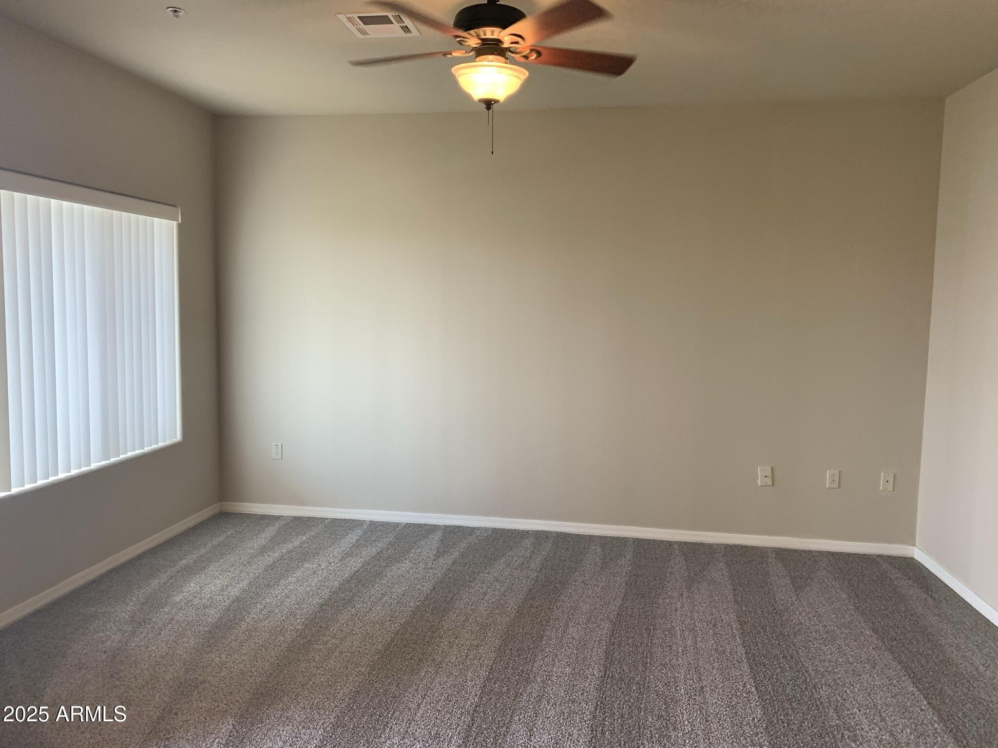 1117 East 8th Street, Unit 3001 Tempe, AZ 85281 - Photo 3 of 16 wooden floor in an empty room with a window