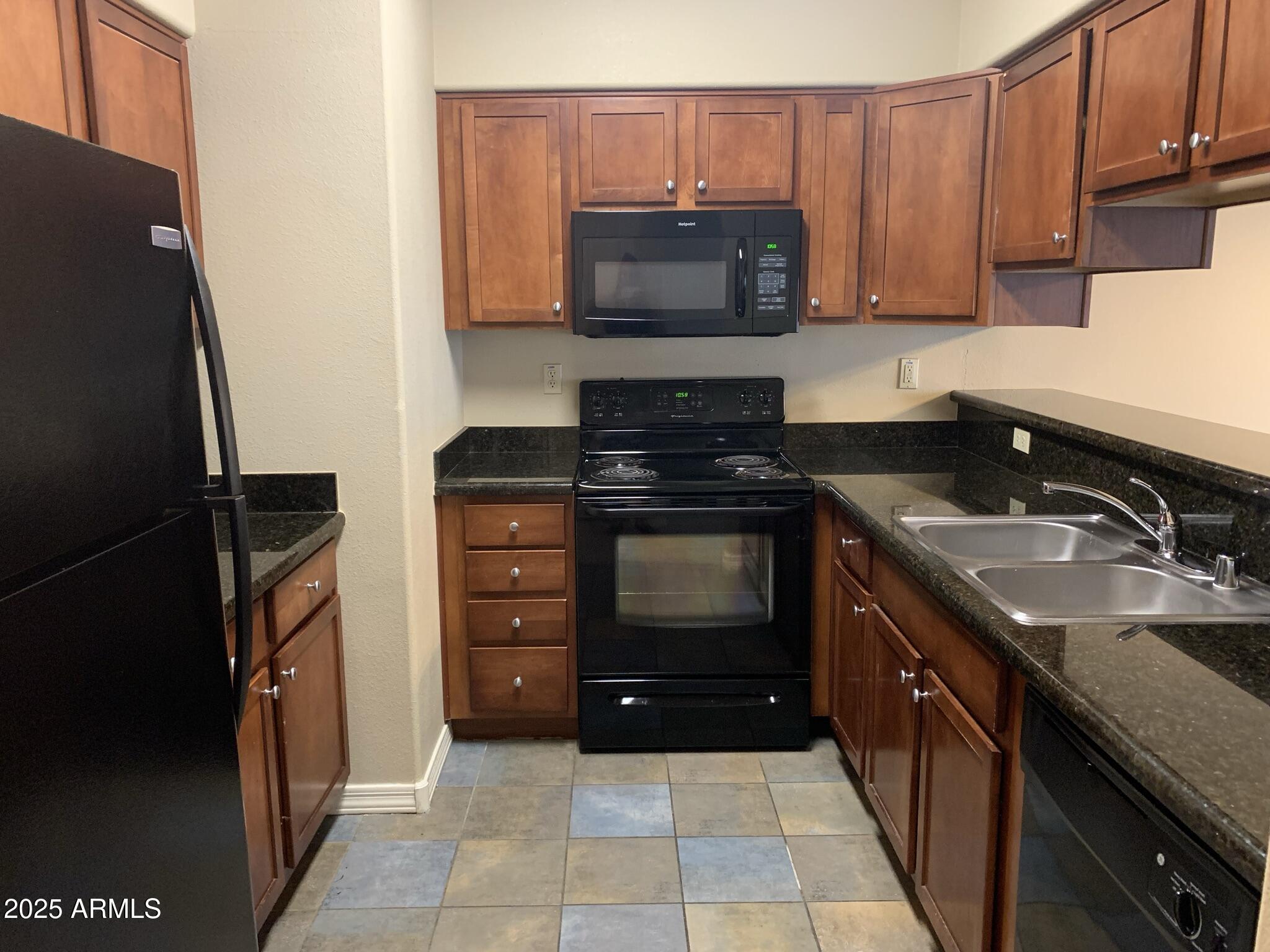 1117 East 8th Street, Unit 3001 Tempe, AZ 85281 - Photo 5 of 16 a kitchen with a sink stove and microwave