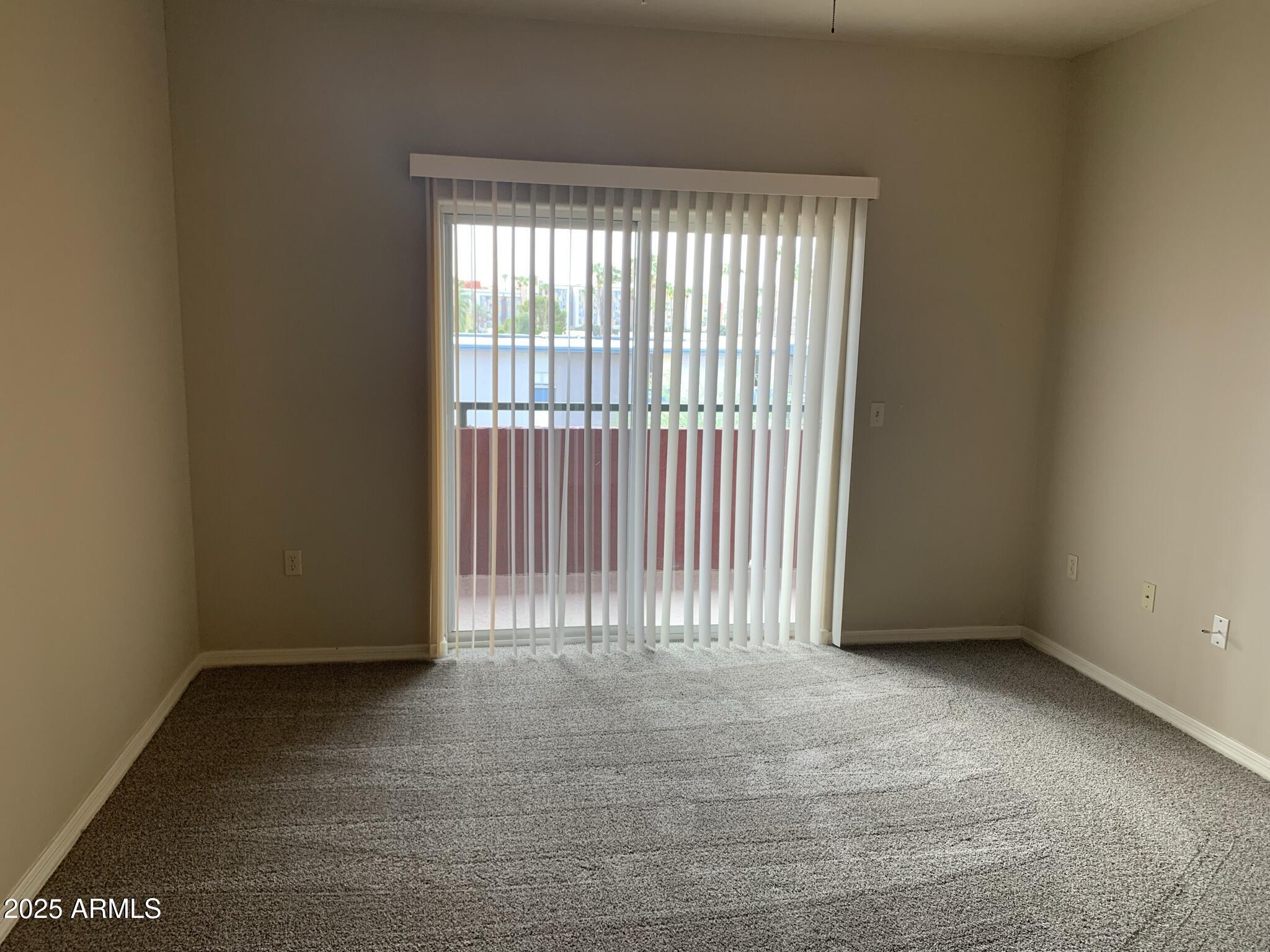 1117 East 8th Street, Unit 3001 Tempe, AZ 85281 - Photo 10 of 16 a view of an empty room with a window
