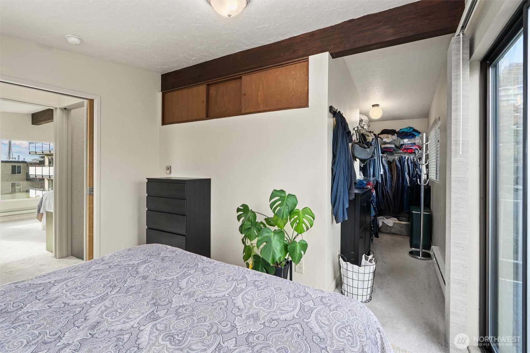 561 Lee Street Seattle, WA 98109 - Photo 20 of 40 a bedroom with a bed and a window