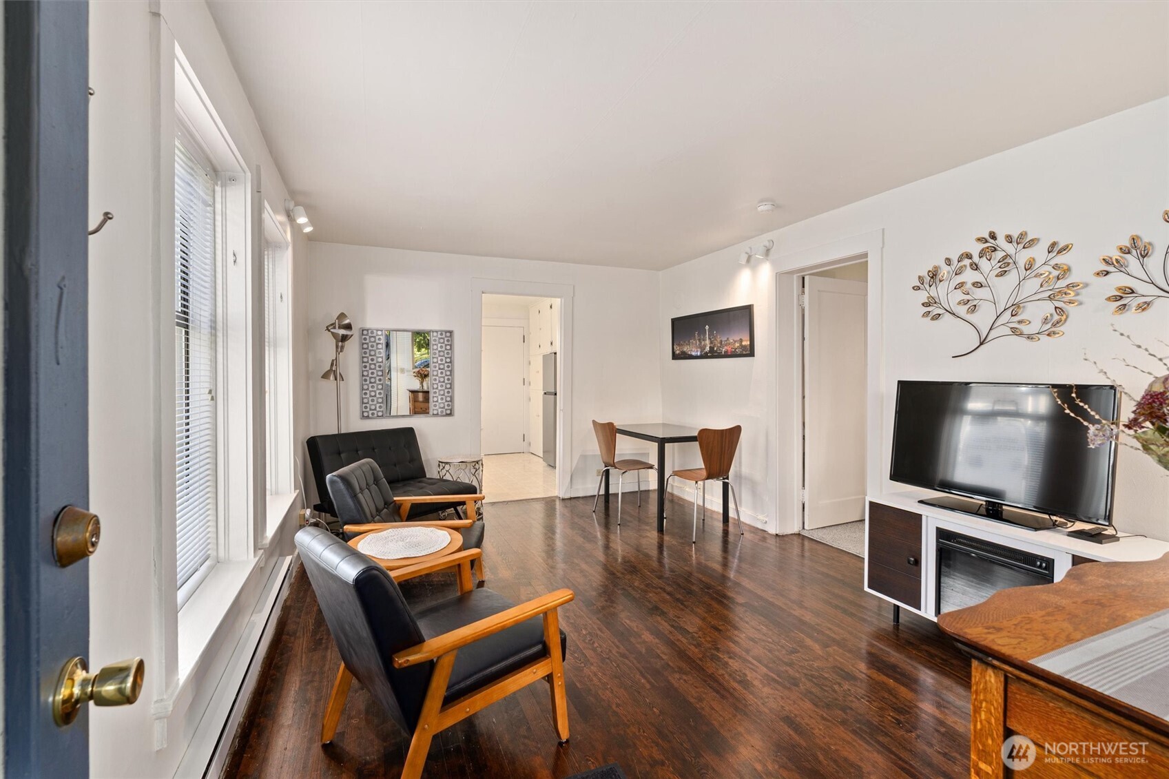 561 Lee Street Seattle, WA 98109 - Photo 26 of 40 a living room with furniture and a flat screen tv