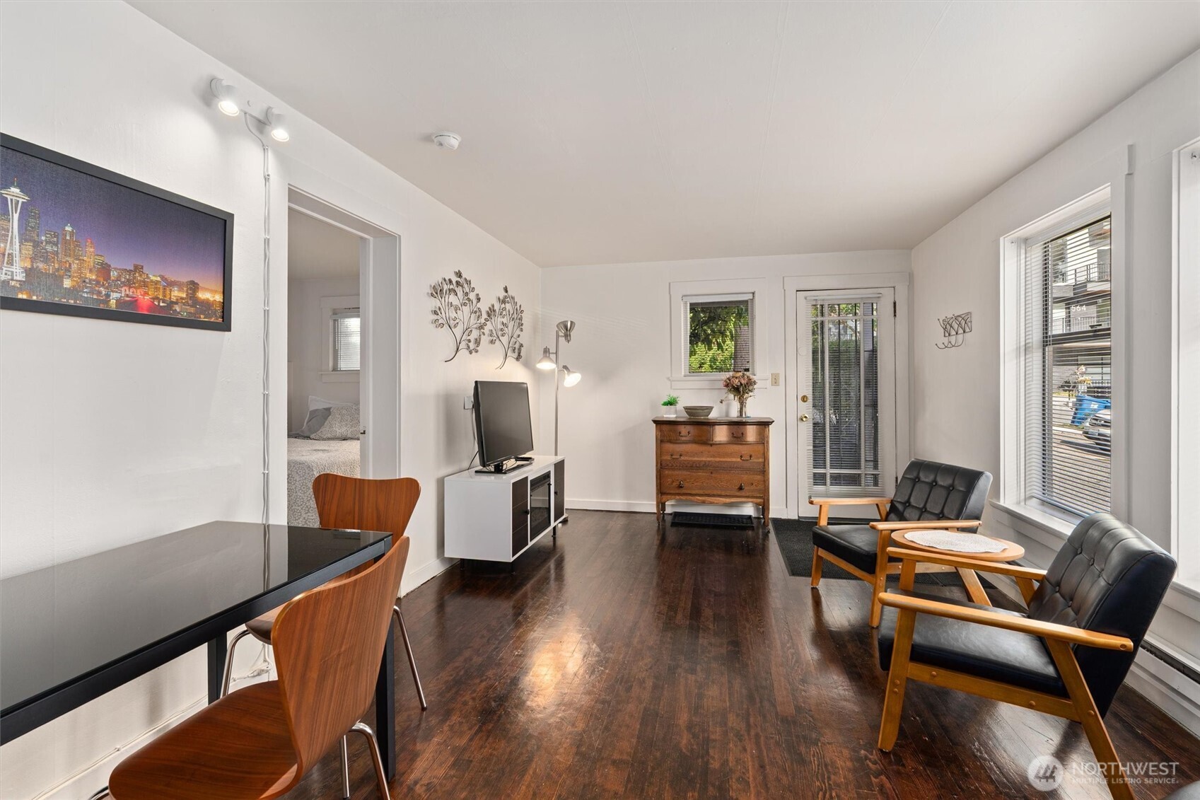561 Lee Street Seattle, WA 98109 - Photo 27 of 40 a living room with furniture a wooden floor and a large window