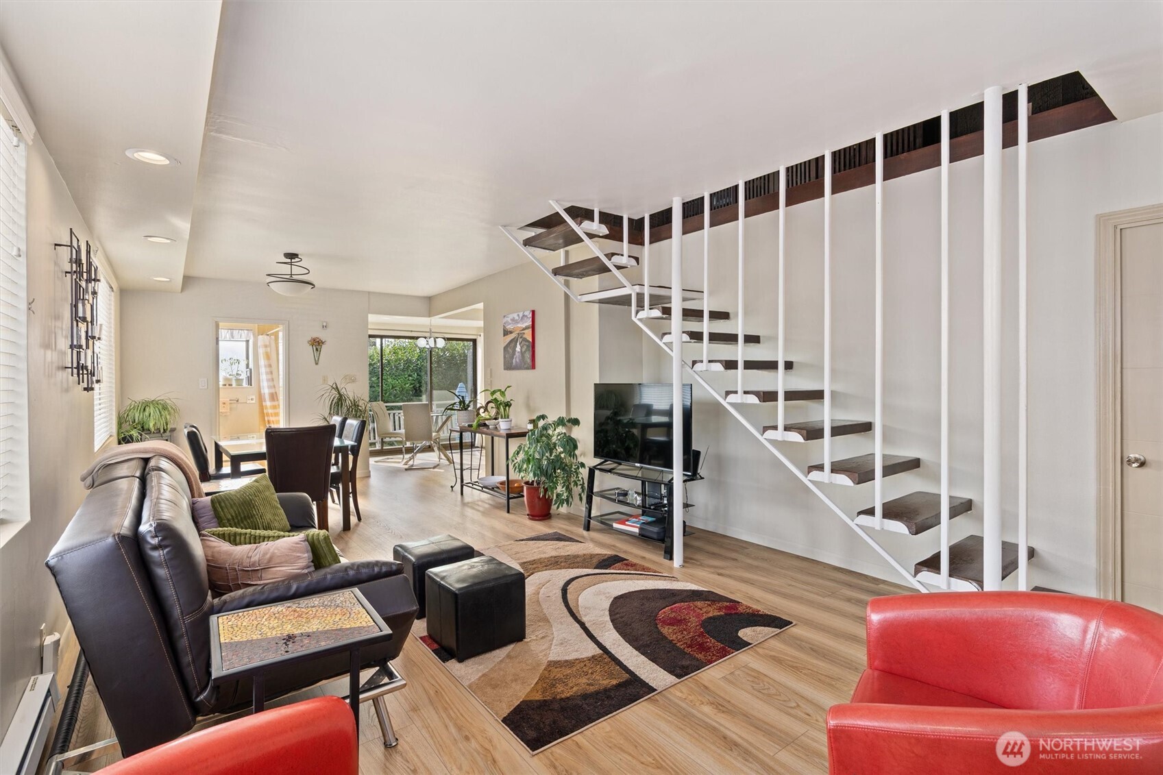 561 Lee Street Seattle, WA 98109 - Photo 3 of 40 a living room with furniture and wooden floor