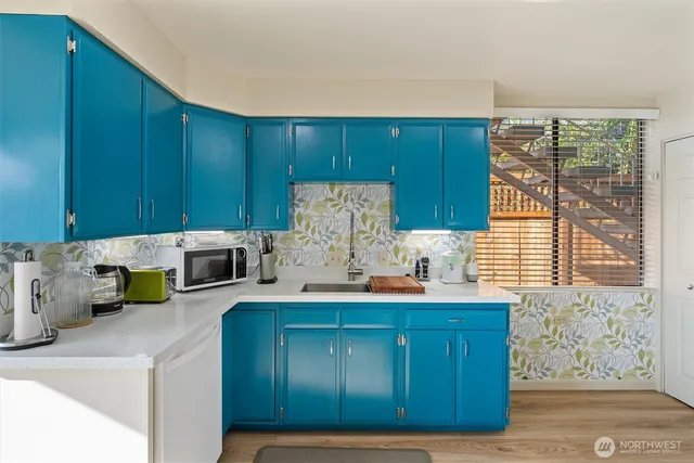 a kitchen with a cabinets and window