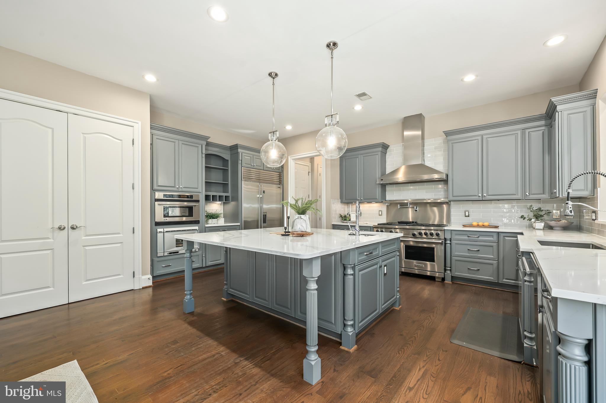 8340 Springhaven Garden Lane McLean, VA 22102 - Photo 11 of 76 a kitchen with stainless steel appliances granite countertop a sink stove and refrigerator