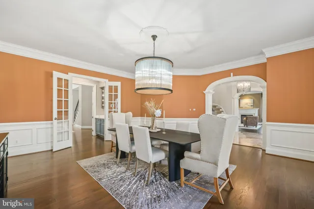 a living room with fireplace furniture and a rug