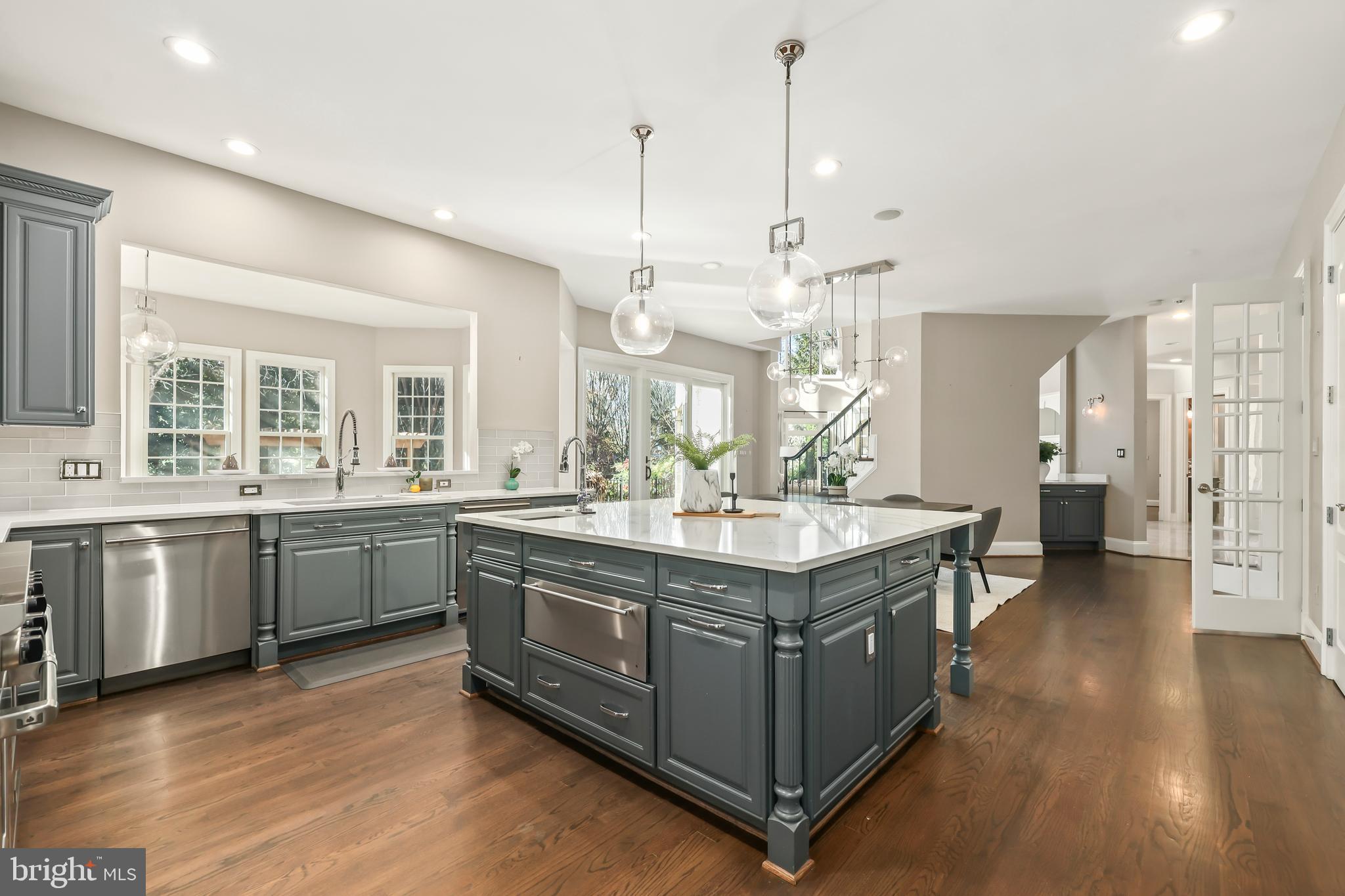 8340 Springhaven Garden Lane McLean, VA 22102 - Photo 12 of 76 a kitchen with stainless steel appliances granite countertop a stove and a sink
