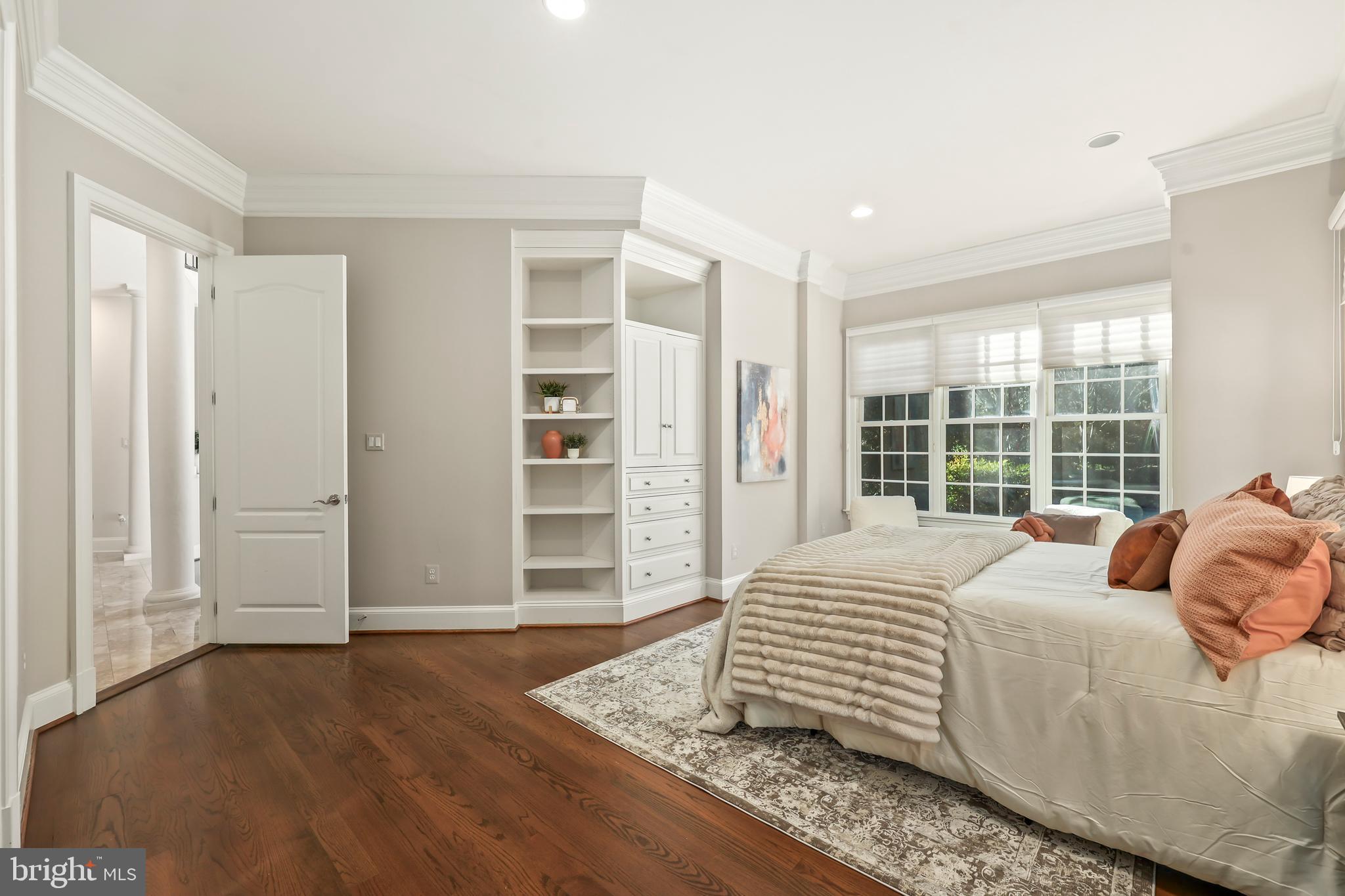 8340 Springhaven Garden Lane McLean, VA 22102 - Photo 24 of 76 a large bedroom with a bed and wooden floor
