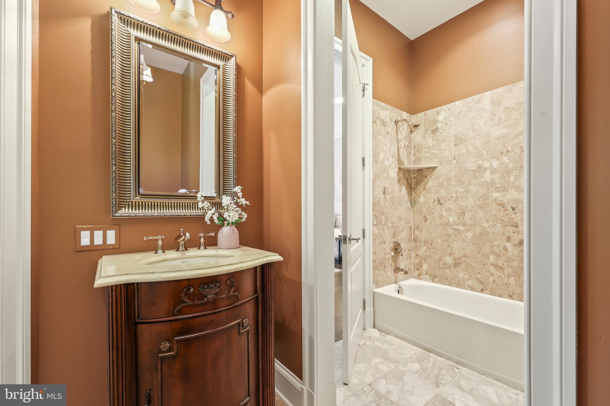 8340 Springhaven Garden Lane McLean, VA 22102 - Photo 29 of 76 a bathroom with a sink and a mirror