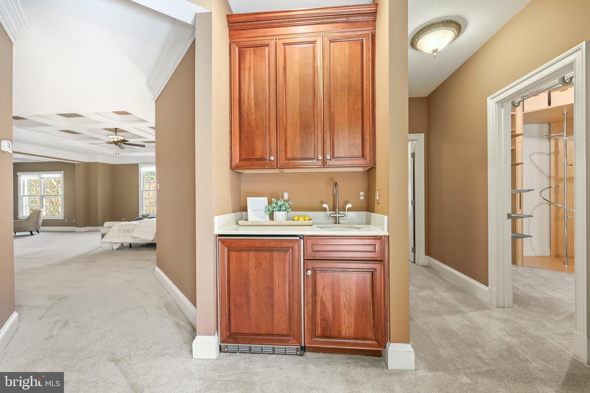 8340 Springhaven Garden Lane McLean, VA 22102 - Photo 37 of 76 a bathroom with a granite countertop sink and a mirror