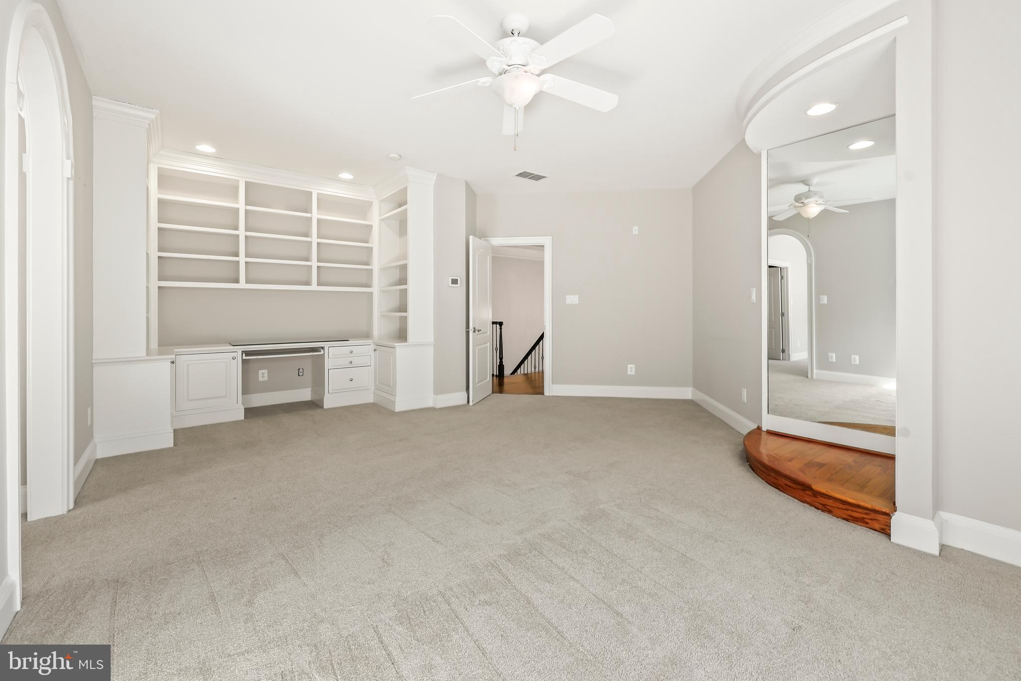 8340 Springhaven Garden Lane McLean, VA 22102 - Photo 46 of 76 an empty room with windows and pillars in it