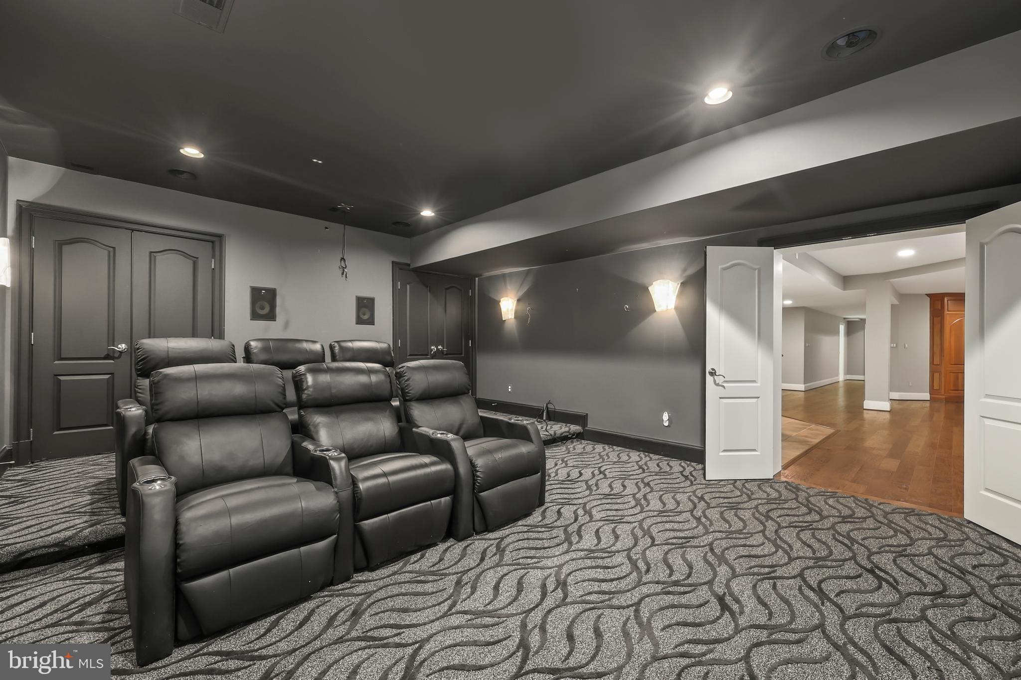 8340 Springhaven Garden Lane McLean, VA 22102 - Photo 60 of 76 a media room with lots of chairs and wooden floor
