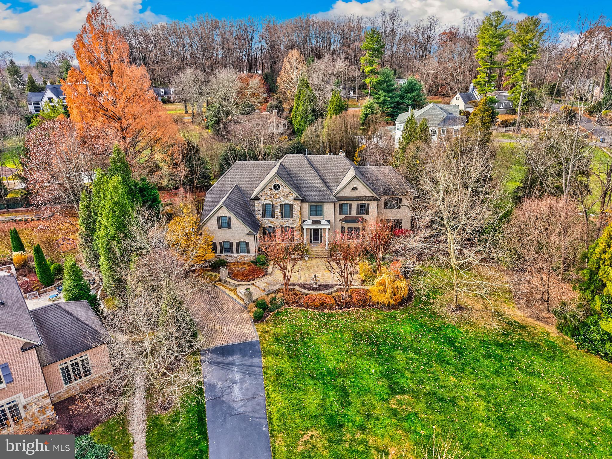 8340 Springhaven Garden Lane McLean, VA 22102 - Photo 69 of 76 an aerial view of a house with a big yard and large trees