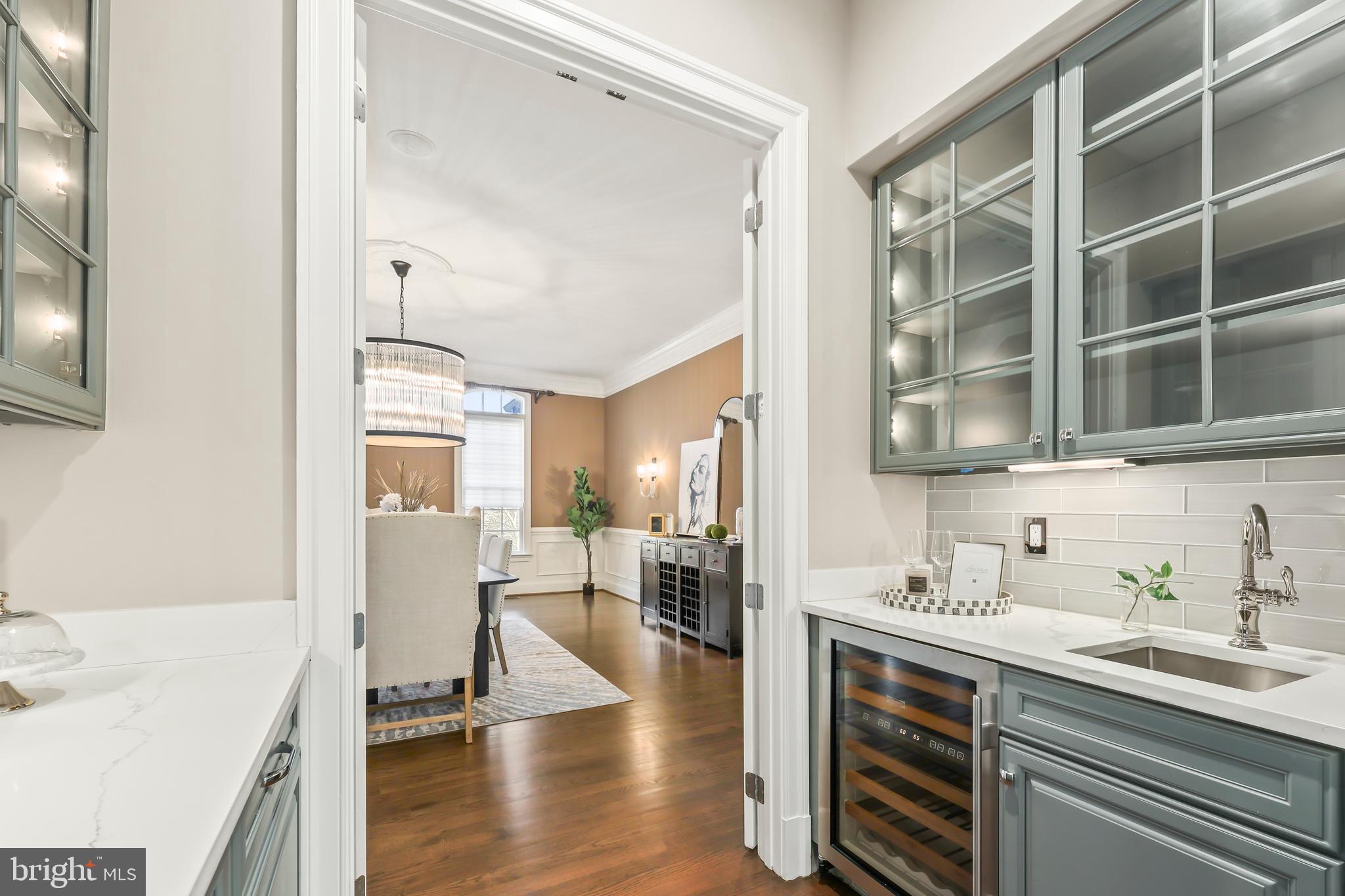 8340 Springhaven Garden Lane McLean, VA 22102 - Photo 9 of 76 a open kitchen with a sink cabinets and wooden floor