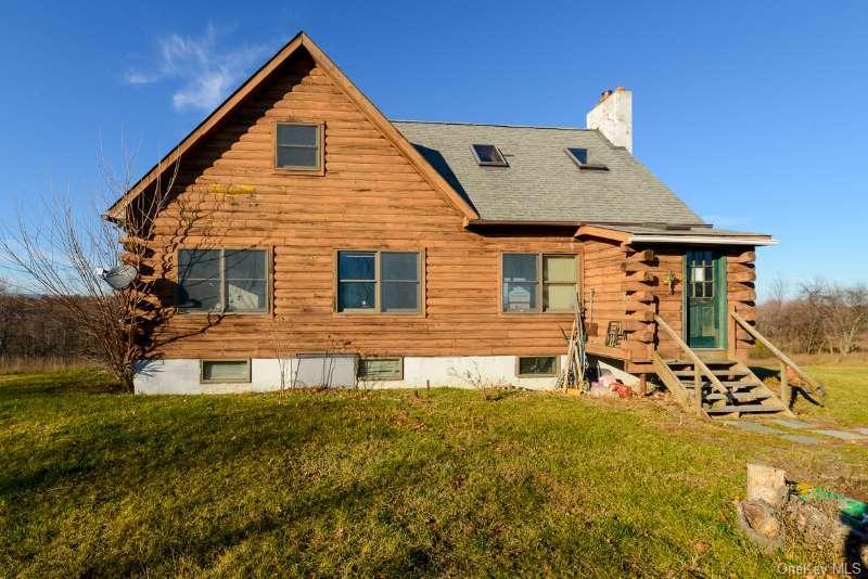 645 Bullville Road Montgomery, NY 12549 - Photo 4 of 4 a front view of a house with a yard